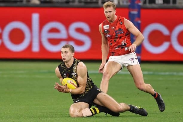 Callum Coleman-Jones of the Tigers marks the ball during the round 12 AFL match between the Essendon Bombers and the Richmond Tigers at Optus Stadium...