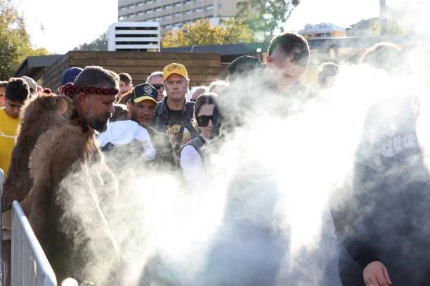 The Long Walk participants walk thru a smoking ceremony before commencing the walk from the WACA to Optus Stadium during the round 12 AFL match...