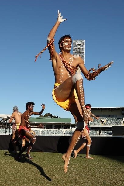 Aboriginal dancers perform prior to the Long Walk from the WACA to Optus Stadium during the round 12 AFL match between the Essendon Bombers and the...