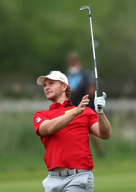 Nick Bachem of German plays his third shot on the fourth hole during the first round of the Porsche European Open at Green Eagle Golf Course on June...