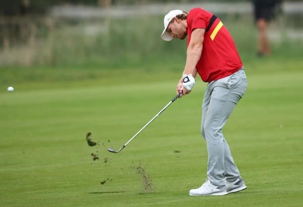 Nick Bachem of German plays his third shot on the fourth hole during the first round of the Porsche European Open at Green Eagle Golf Course on June...