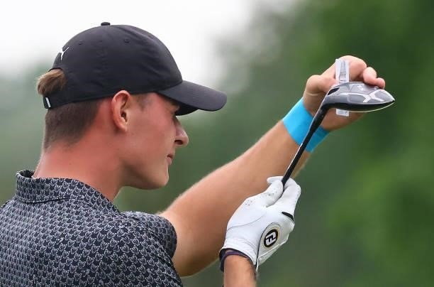Jannik De Bruyn of Germany inspects his 3 wood after teeing off on the fourth hole during the first round of the Porsche European Open at Green Eagle...