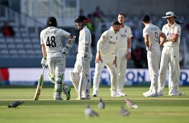 Kane Williamson of New Zealand speaks to Tom Latham as he waits for his review to be overturned during Day 4 of the First LV= Insurance Test Match...