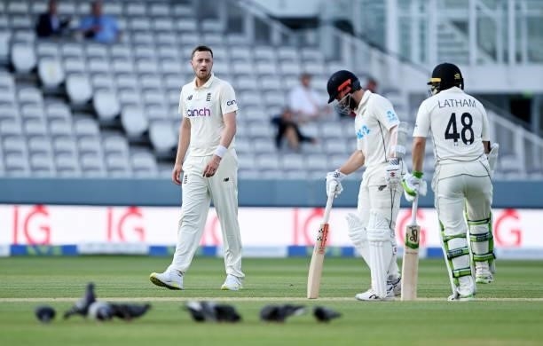 Ollie Robinson of England looks at Kane Williamson of New Zealand after an overturned review during Day 4 of the First LV= Insurance Test Match...