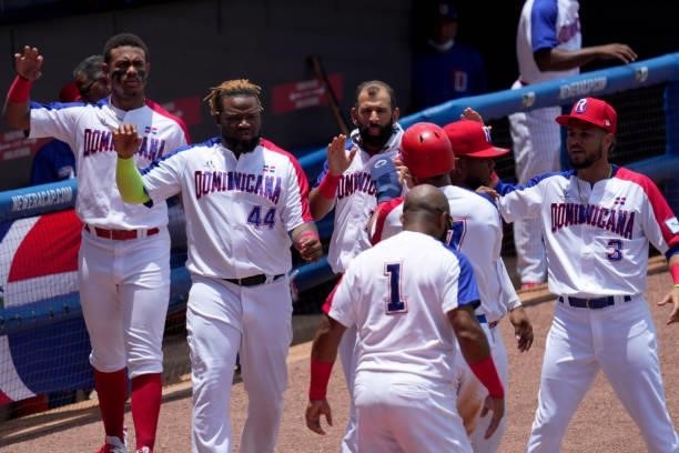 The Dominican Republic celebrates scoring a run in the second inning against Canada during the WBSC Baseball Americas Qualifier Super Round at Clover...
