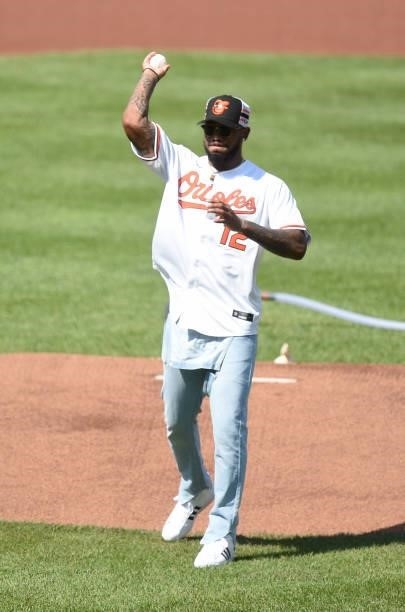 Rashod Bateman of the Baltimore Ravens throws out the first pitch before the game between the Baltimore Orioles and the Cleveland Indians at Oriole...