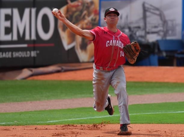 Eric Wood of Canada fields the ball hit by José Bautista of Dominican Republic in the seventh inning during the WBSC Baseball Americas Qualifier...