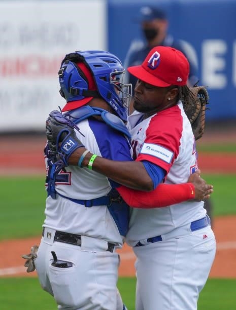 Jairo Ascencio and Charlie Valerio of Dominican Republic celebrate after coming from behind to defeat Canada by score of 6-5 during the WBSC Baseball...
