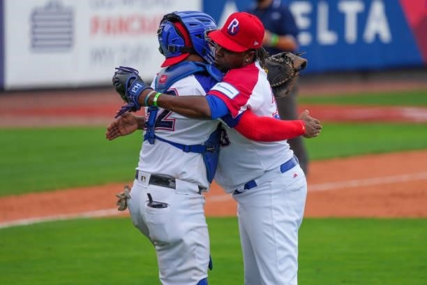Jairo Ascencio and Charlie Valerio of Dominican Republic celebrate after coming from behind to defeat Canada by score of 6-5 during the WBSC Baseball...