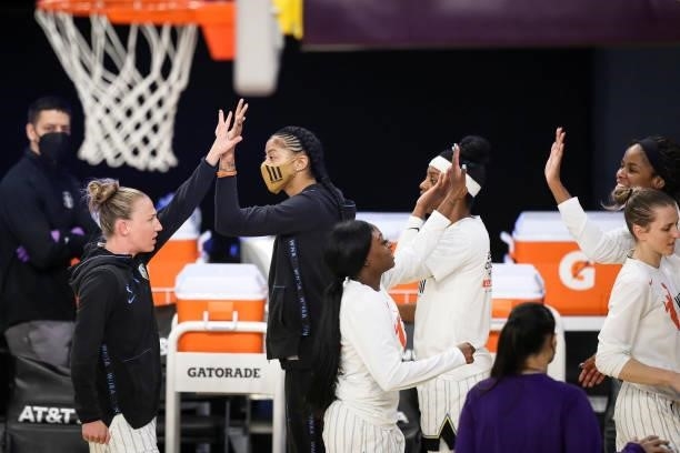 Candace Parker of the Chicago Sky high-fives teammates ahead of the game against her former team, the Los Angeles Sparks at Los Angeles Convention...