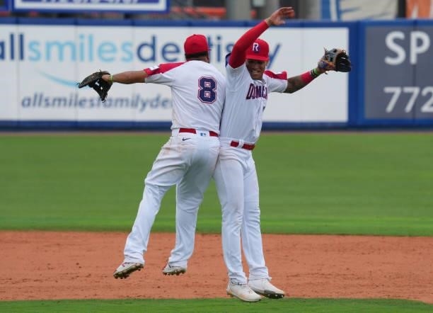Diego Goris and Jeison Guzmán of Dominican Republic celebrate after coming from behind to defeat Canada by score of 6-5 during the WBSC Baseball...