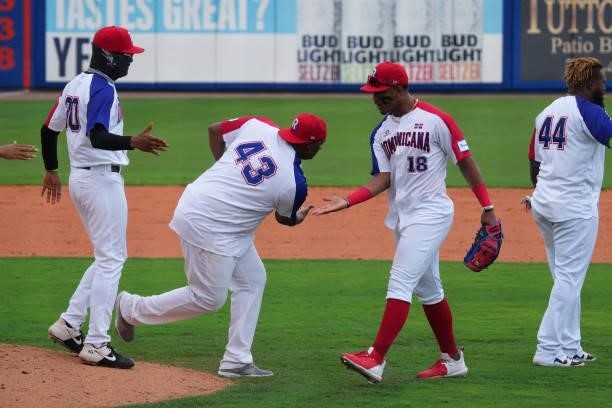 Julio Rodríguez and José Díaz of Dominican Republic celebrate after coming from behind to defeat Canada by score of 6-5 during the WBSC Baseball...