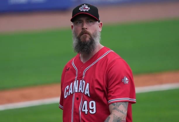 John Axford of Canada looks on after pitching in the eighth inning against the Dominican Republic during the WBSC Baseball Americas Qualifier Super...