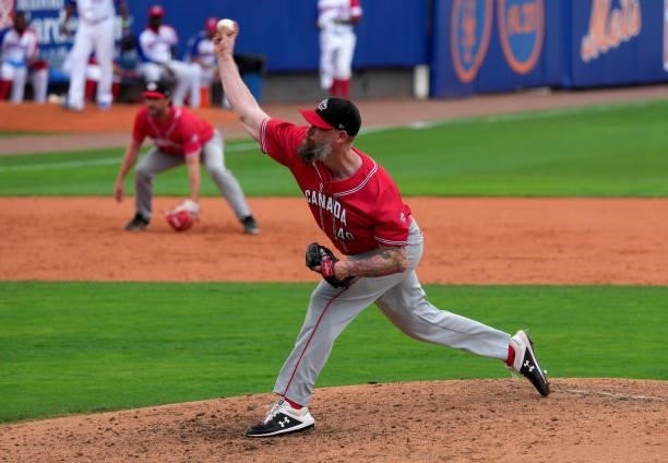 John Axford of Canada delivers a pitch in the eighth inning against the Dominican Republic during the WBSC Baseball Americas Qualifier Super Round at...