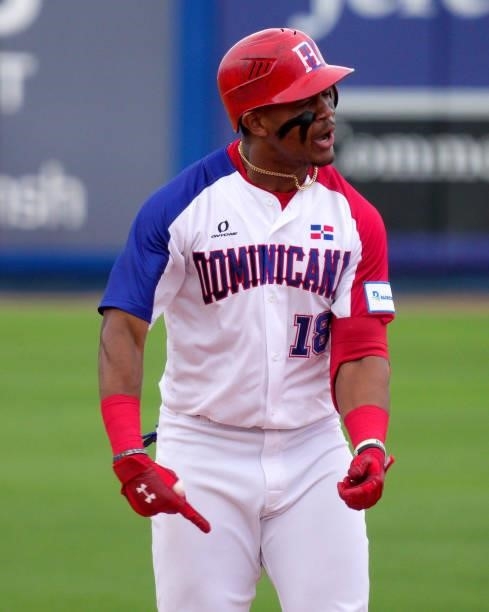 Julio Rodríguez of Dominican Republic reacts on base after hitting a double for two rbi's to take the lead in the eighth inning against Canada during...