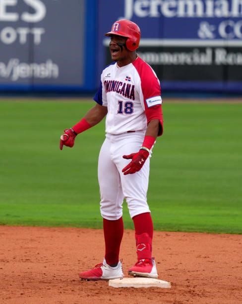 Julio Rodríguez of Dominican Republic reacts on base after hitting a double for two rbi's to take the lead in the eighth inning against Canada during...