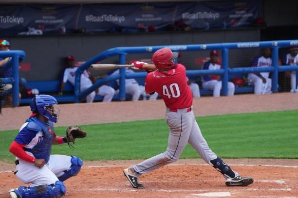Daniel Pinero of Canada singles for an rbi in the eighth inning against the Dominican Republic during the WBSC Baseball Americas Qualifier Super...