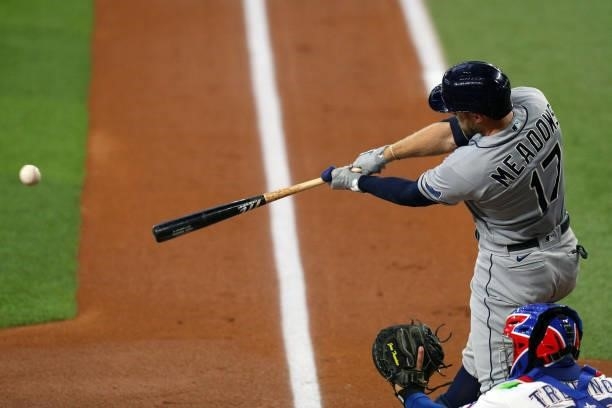 Austin Meadows of the Tampa Bay Rays hits a single that scored two runs in the first inning against the Texas Rangers at Globe Life Field on June 05,...