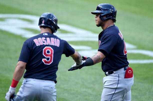 Harold Ramirez of the Cleveland Indians celebrates with Eddie Rosario after hitting a home run in the first inning against the Baltimore Orioles at...