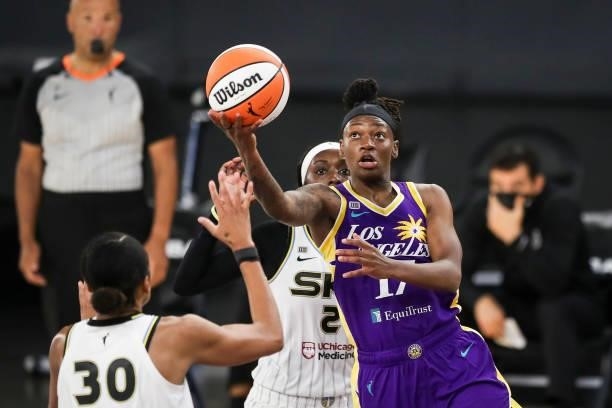 Erica Wheeler of the Los Angeles Sparks drives to the basket defended by Azurá Stevens of the Chicago Sky in the second half at Los Angeles...