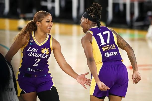 Erica Wheeler of the Los Angeles Sparks celebrates her three point basket in the final minute of play against the Chicago Sky with Te'a Cooper at Los...
