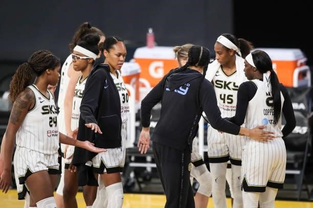 Candace Parker of the Chicago Sky huddles with teammates Kahleah Copper, Astou Ndour-Fall, Azurá Stevens, and Ruthy Hebard after their loss to the...