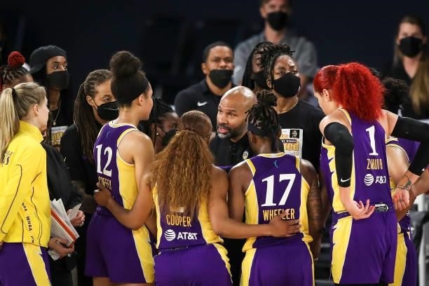 Los Angeles Sparks head coach Derek Fisher talks with the team during a time out in the second half against the Chicago Sky at Los Angeles Convention...