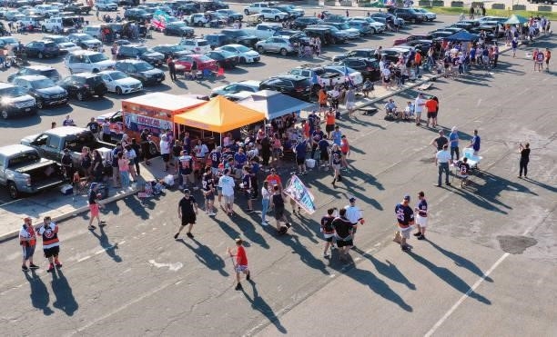 In an aerial view, fans tailgate prior to the game between the New York Islanders and the Boston Bruins in Game Four of the Second Round of the 2021...