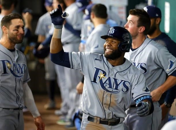 Manuel Margot of the Tampa Bay Rays celebrates in the dugout after hitting a solo home run against the Texas Rangers in the eighth inning at Globe...