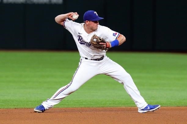 Nick Solak of the Texas Rangers makes the throw to first for an out in the seventh inning against the Tampa Bay Rays at Globe Life Field on June 05,...