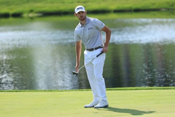 Patrick Cantlay of the United States reacts to his putt on the 17th green during the third round of The Memorial Tournament at Muirfield Village Golf...