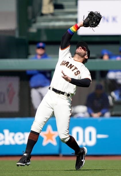 Mike Tauchman of the San Francisco Giants catches a fly ball off the bat of Joc Pederson of the Chicago Cubs in the top of the first inning at Oracle...