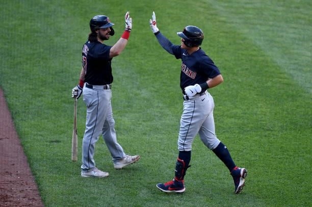 Yu Chang of the Cleveland Indians celebrates with Austin Hedges after hitting a three-run home run in the third inning against the Baltimore Orioles...