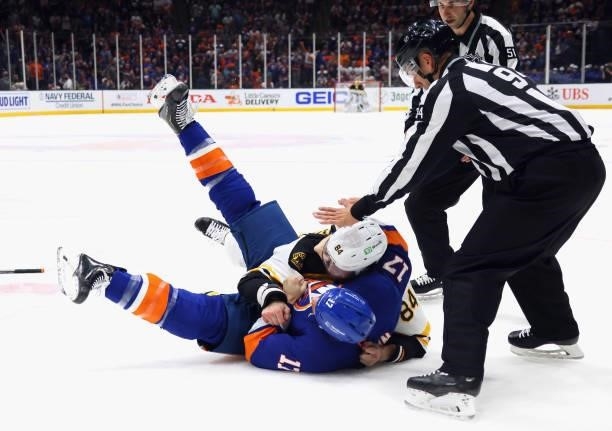 Matt Martin of the New York Islanders and Jarred Tinordi of the Boston Bruins fight during the first period in Game Four of the Second Round of the...