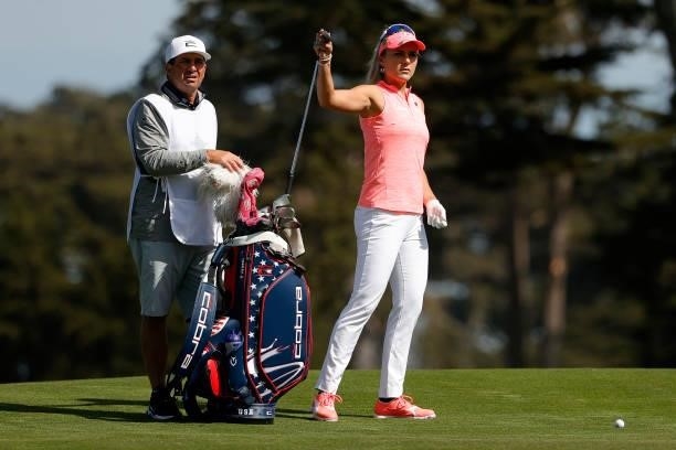 Lexi Thompson of the United States selects a club for her second shot on the 11th hole during the third round of the 76th U.S. Women's Open...