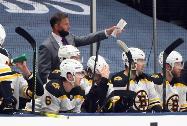 Head coach Bruce Cassidy of the Boston Bruins handles the bench against the New York Islanders in Game Four of the Second Round of the 2021 NHL...