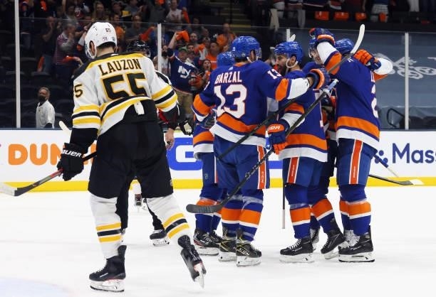 The New York Islanders celebrate a second period goal by Kyle Palmieri against the Boston Bruins in Game Four of the Second Round of the 2021 NHL...