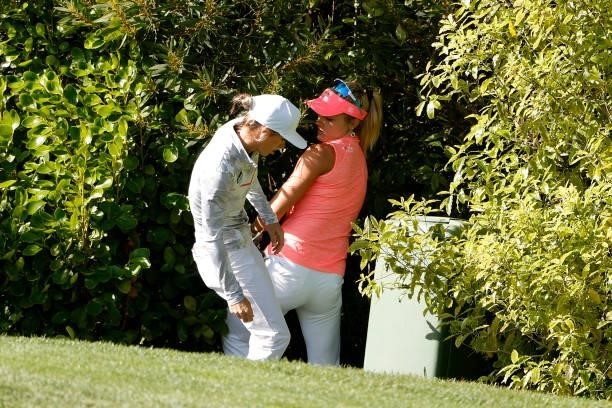 Lexi Thompson of the United States helps Mel Reid of England look for her ball on the 14th hole during the third round of the 76th U.S. Women's Open...