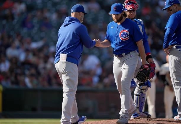 Manager David Ross of the Chicago Cubs takes the ball from pitcher Kohl Stewart against the San Francisco Giants in the bottom of the fourth inning...