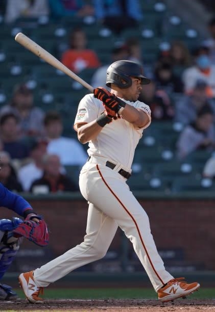 LaMonte Wade Jr of the San Francisco Giants hits an RBI single scoring Jason Vosler against the Chicago Cubs in the bottom of the fourth inning at...