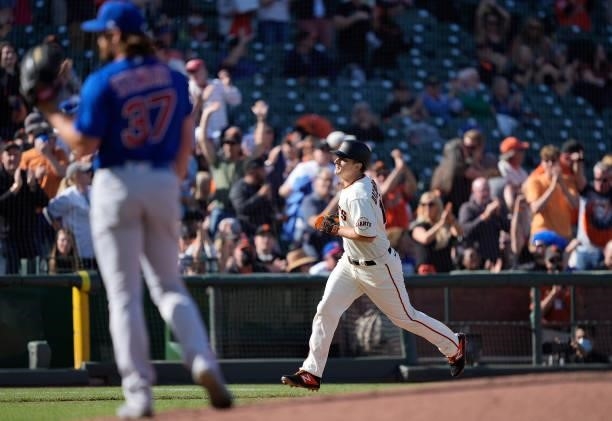 Alex Dickerson of the San Francisco Giants runs around the bases after hitting a solo home run off of Kohl Stewart of the Chicago Cubs in the bottom...