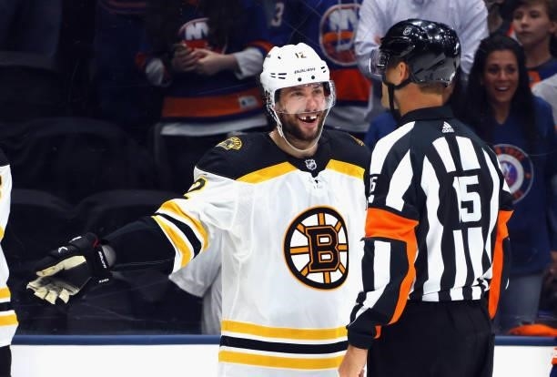 Craig Smith of the Boston Bruins argues a second period penalty with referee Jean Hebert during the game against the New York Islanders in Game Four...