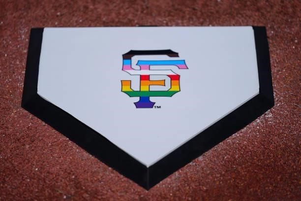 San Francisco Giants logo in Pride colors can be seen on home plate before the game between the Chicago Cubs and the San Francisco Giants at Oracle...