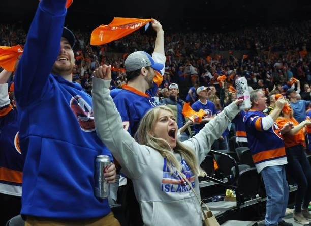 The New York Islanders fans celebrate their 4-1 win over the Boston Bruins in Game Four of the Second Round of the 2021 NHL Stanley Cup Playoffs at...