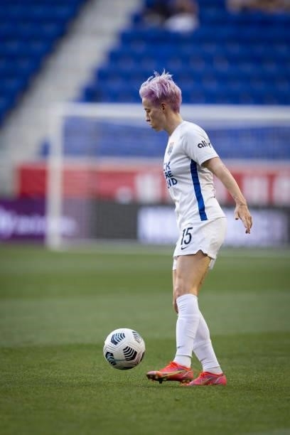Megan Rapinoe of OL Reign takes the ball down the pitch in the first half of the match against NJ/NY Gotham FC at Red Bull Arena on June 5, 2021 in...