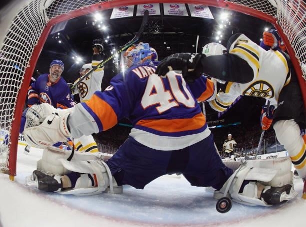 David Krejci of the Boston Bruins scores a second period goal against Semyon Varlamov of the New York Islanders in Game Four of the Second Round of...