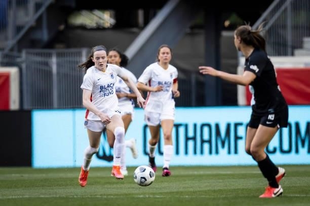 Rose Lavelle of OL Reign takes the ball down the pitch in the first half of the match against NJ/NY Gotham FC at Red Bull Arena on June 5, 2021 in...