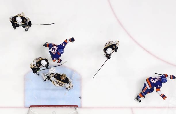 Mathew Barzal of the New York Islanders scores the game winning goal against Tuukka Rask of the Boston Bruins in Game Four of the Second Round of the...