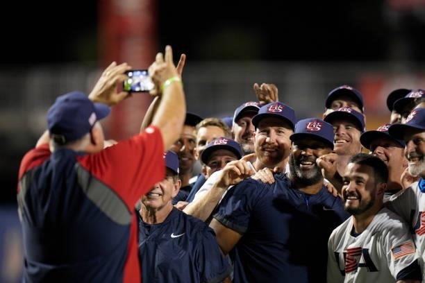United States manager Mike Scioscia takes a team photo on a cell phone after defeating Venezuela 4-2 during the WBSC Baseball Americas Qualifier...