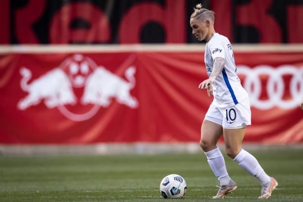 Jessica Fishlock of OL Reign drives the ball down the pitch in the first half of the game against NJ/NY Gotham FC at Red Bull Arena on June 5, 2021...